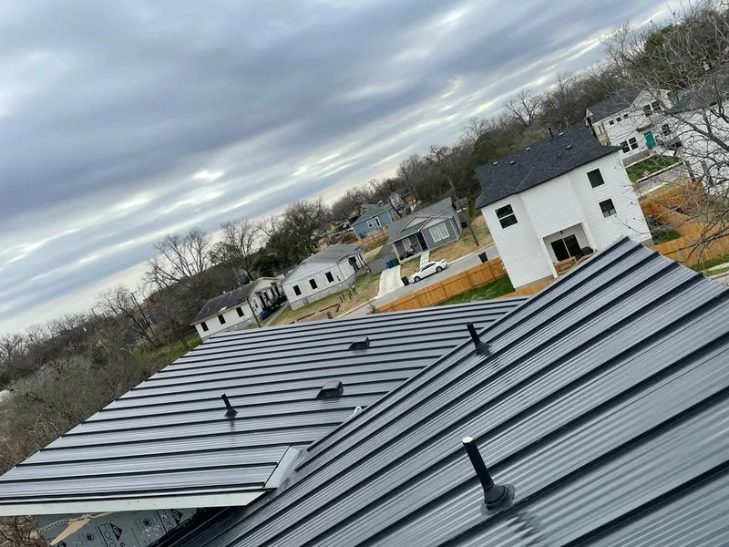 Standing seam metal roof panels with vents for Skylight Repair in Oregon